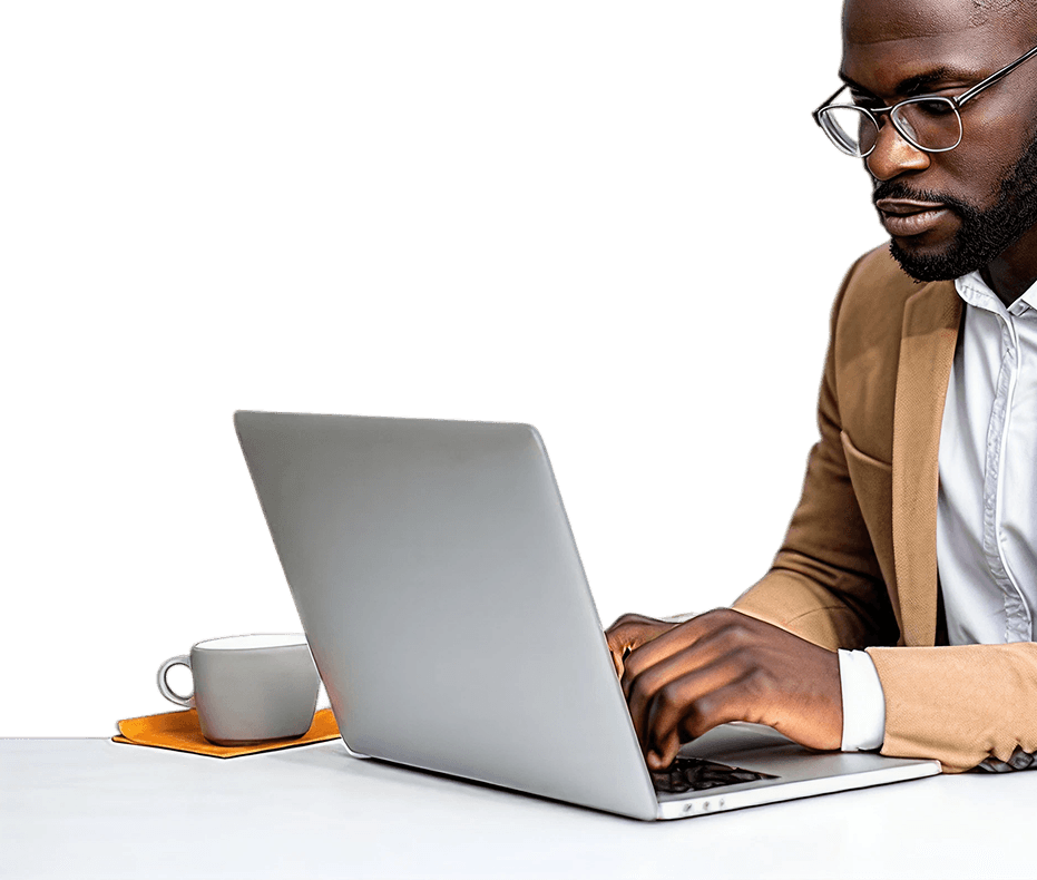 a young man putting on glasses and typing on a laptop